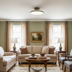 Adjustable ceiling lamp aimed across a warmly lit interior