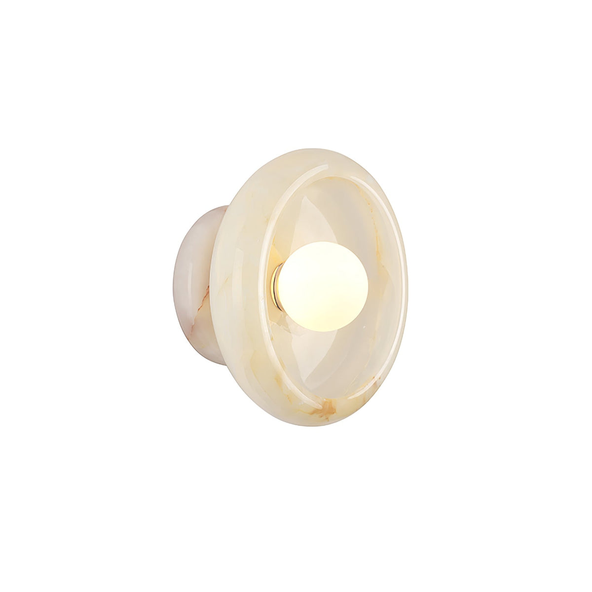 Clérachic cream jade wall sconce lit on a white studio background, the bulb glowing at the centre of the disc.