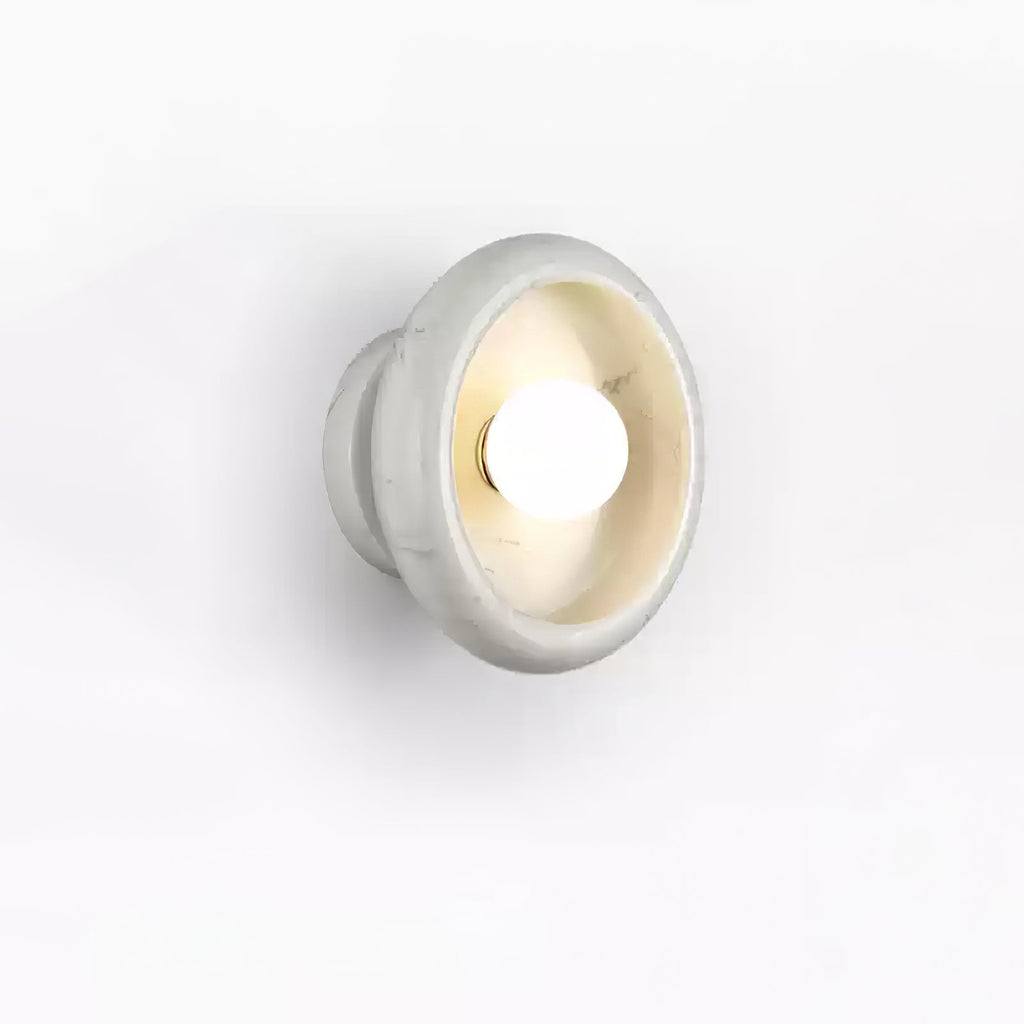 Clérachic white marble wall sconce shown from a slightly different angle on a white studio background.