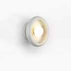 Clérachic white marble wall sconce shown from a slightly different angle on a white studio background.