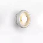 Clérachic white marble wall sconce photographed at an angle on a plain white studio background.