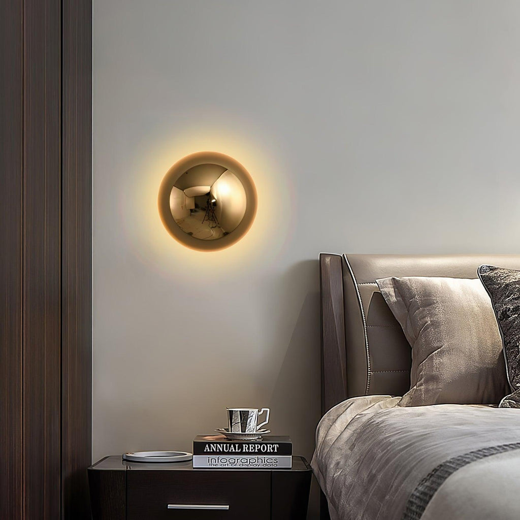 Polished sphere wall sconce with glossy gold surface