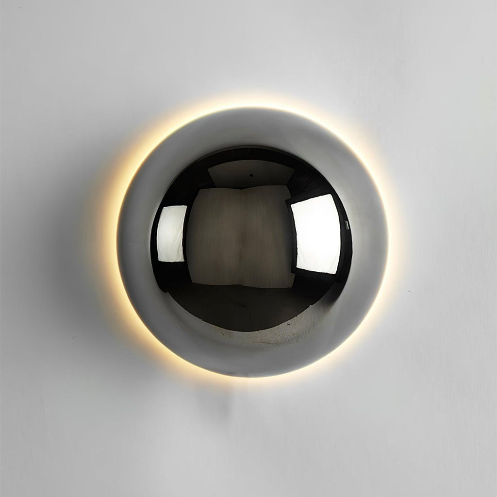 Polished sphere wall sconce with reflective metal finish