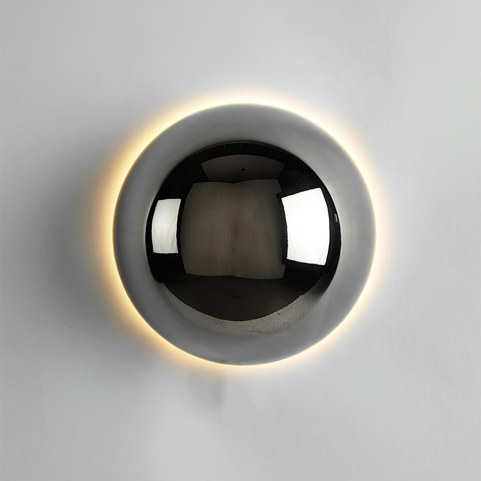 Polished sphere wall sconce with reflective metal finish