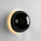 Polished sphere wall sconce in a contemporary setting