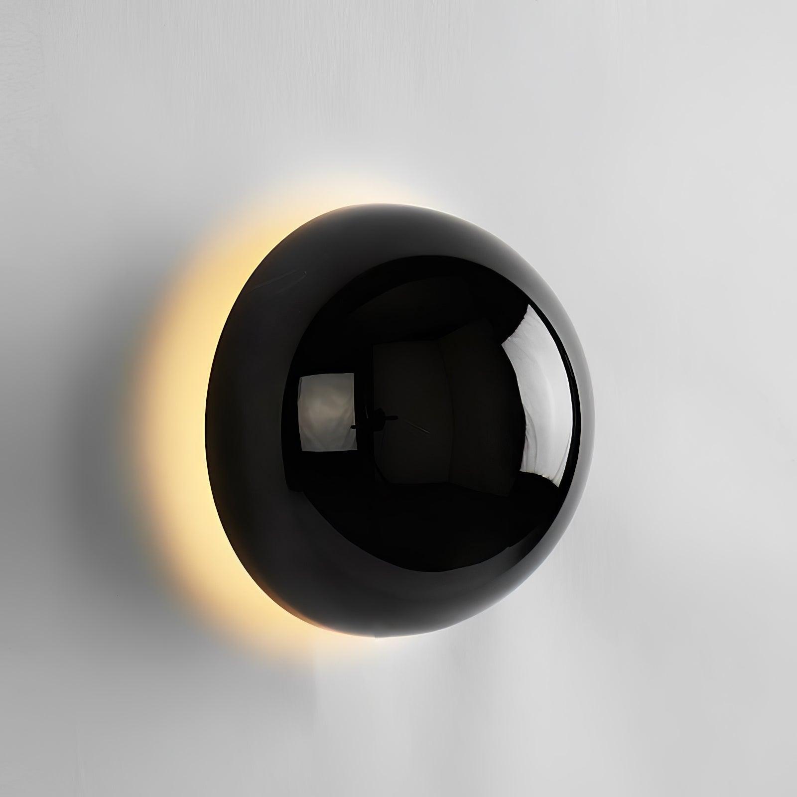 Polished sphere wall sconce in a contemporary setting