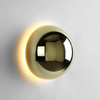 Polished sphere wall sconce with mirror-like gold finish