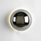 Polished sphere wall sconce showing rounded reflective form