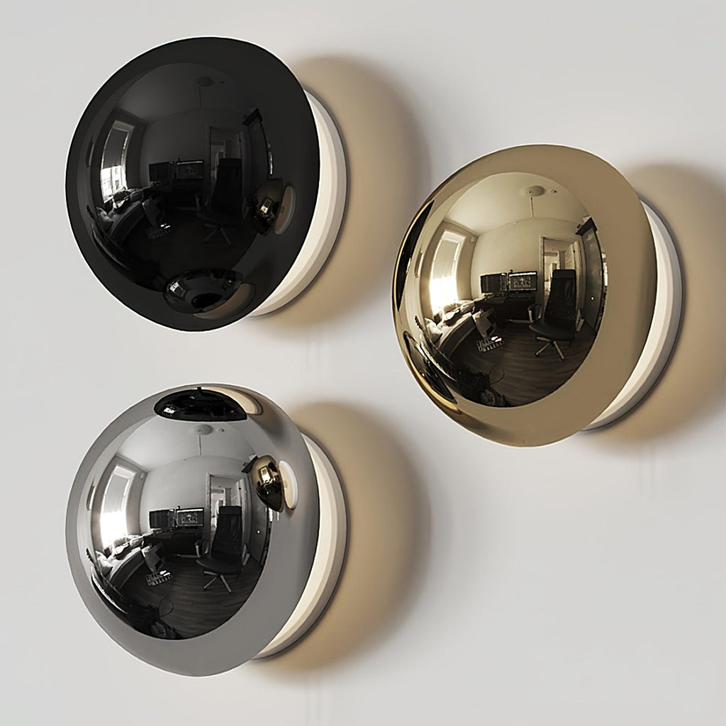 Polished sphere wall sconce glowing in a chic interior
