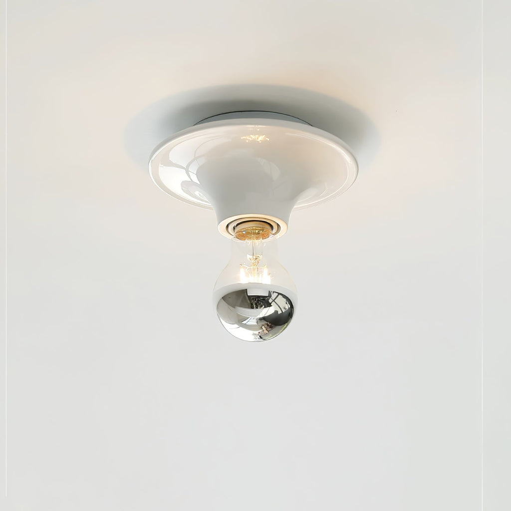 Eclipta wall sconce mounted in a calm, minimalist room