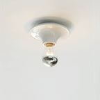 Eclipta wall sconce mounted in a calm, minimalist room