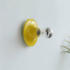 Eclipta wall sconce mounted above a console in a styled space