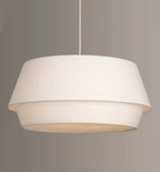 Close view of the stepped white linen tiers on this Clérachic pendant, seen from slightly below.