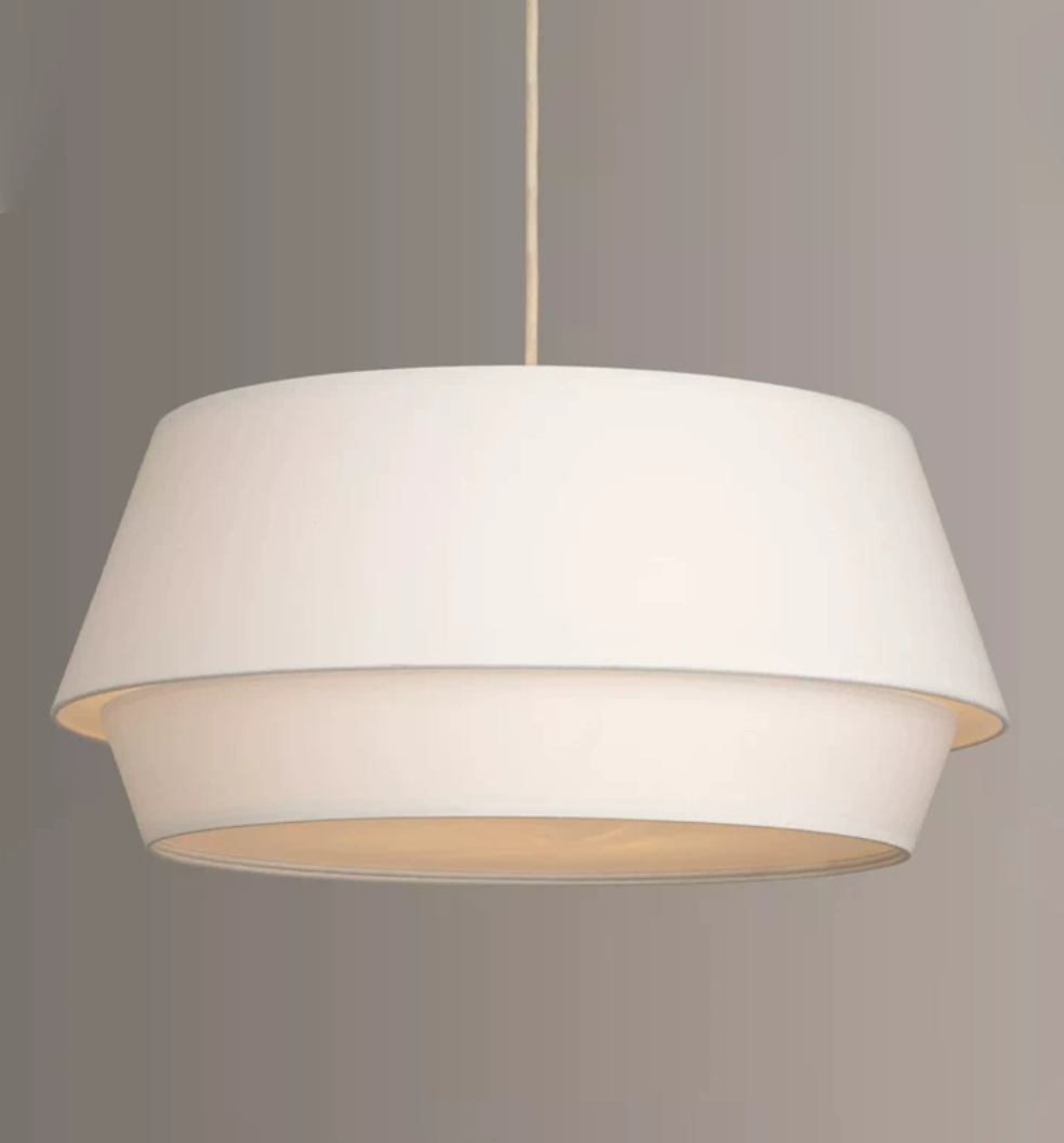 Close view of the stepped white linen tiers on this Clérachic pendant, seen from slightly below.