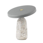 Grey marble Clérachic table lamp with a pale grey disc shade, shown on a plain white background in a studio product shot.