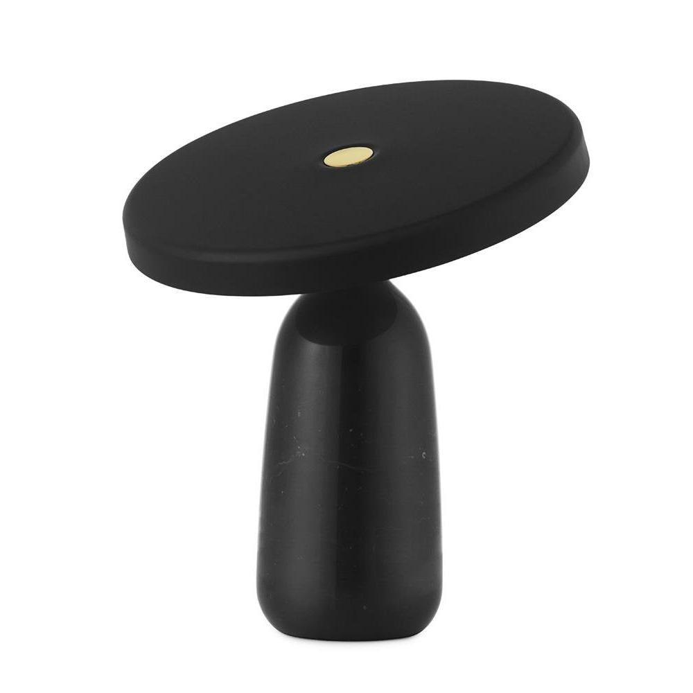Studio product shot of the black Clérachic table lamp on a plain white background, disc shade held level above the base.