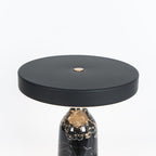 Black marble Clérachic table lamp, disc shade level, shown from a slightly different angle in a close studio crop.