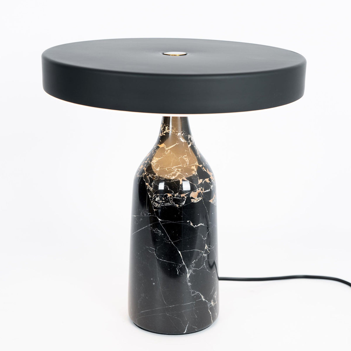 Black marble Clérachic table lamp, disc shade held level, medium studio crop with its cord visible on white.