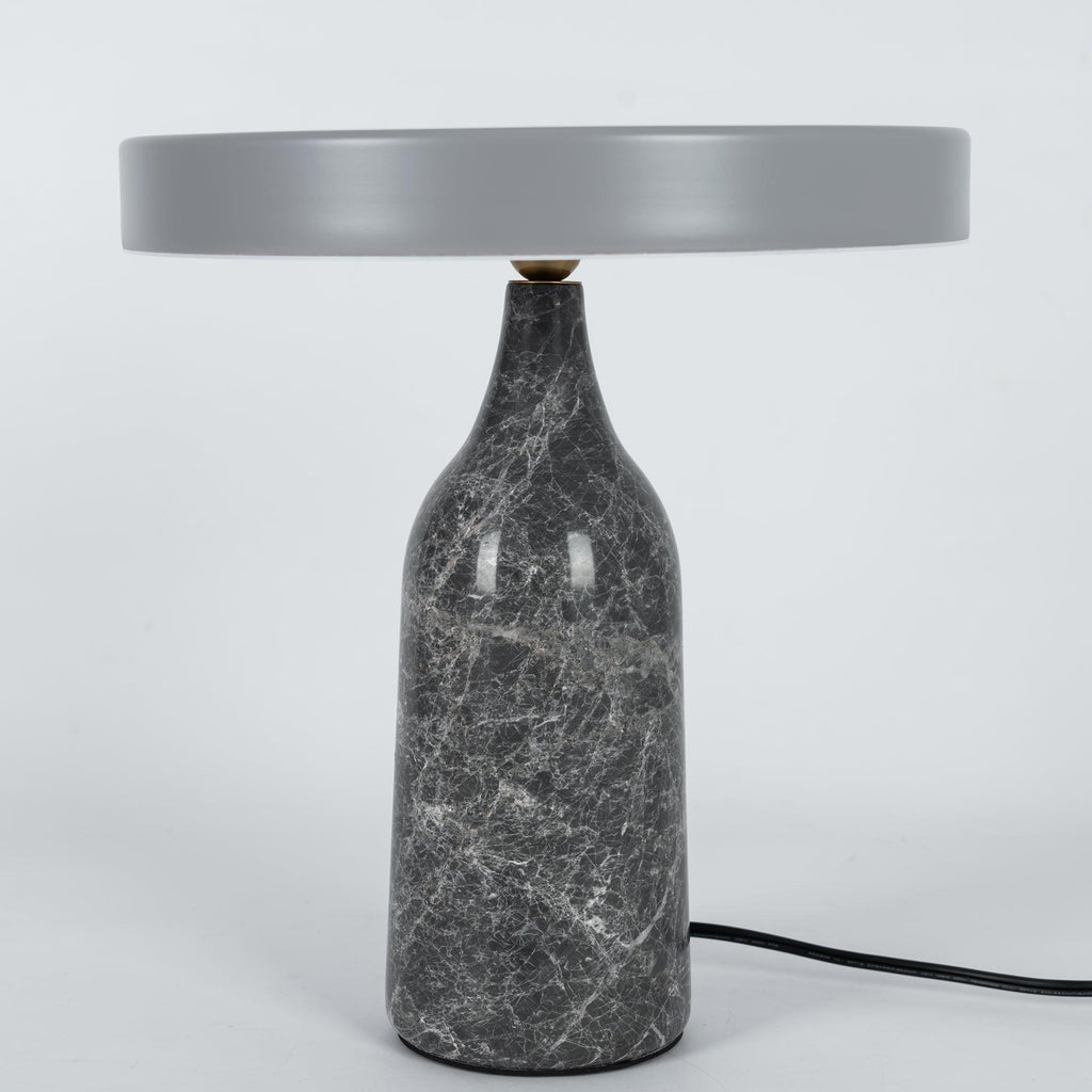 Grey marble Clérachic table lamp with a matching grey disc shade held level, shown with its cord on white.