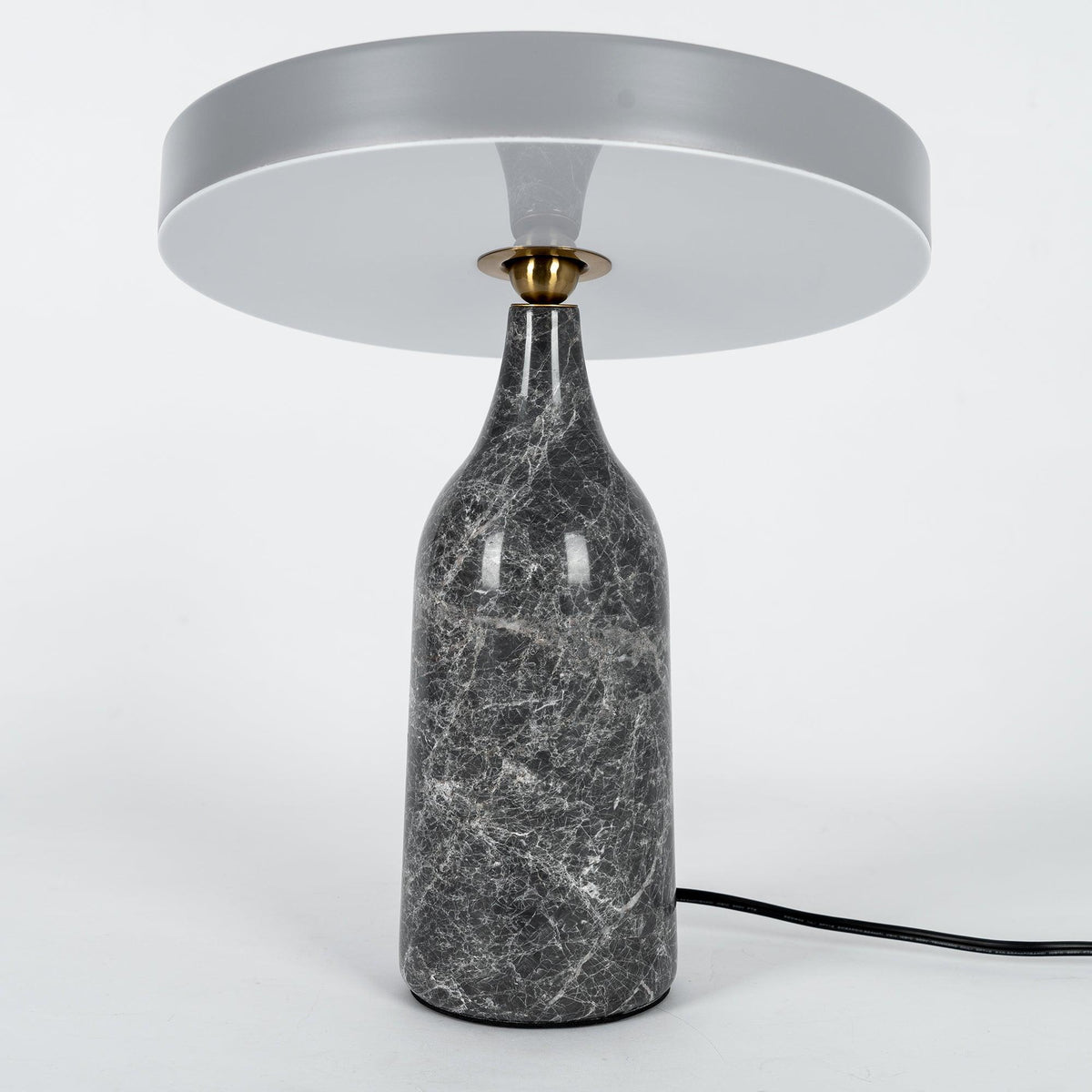 Grey marble Clérachic table lamp with its disc shade angled nearly edge-on, shown on a plain white background.