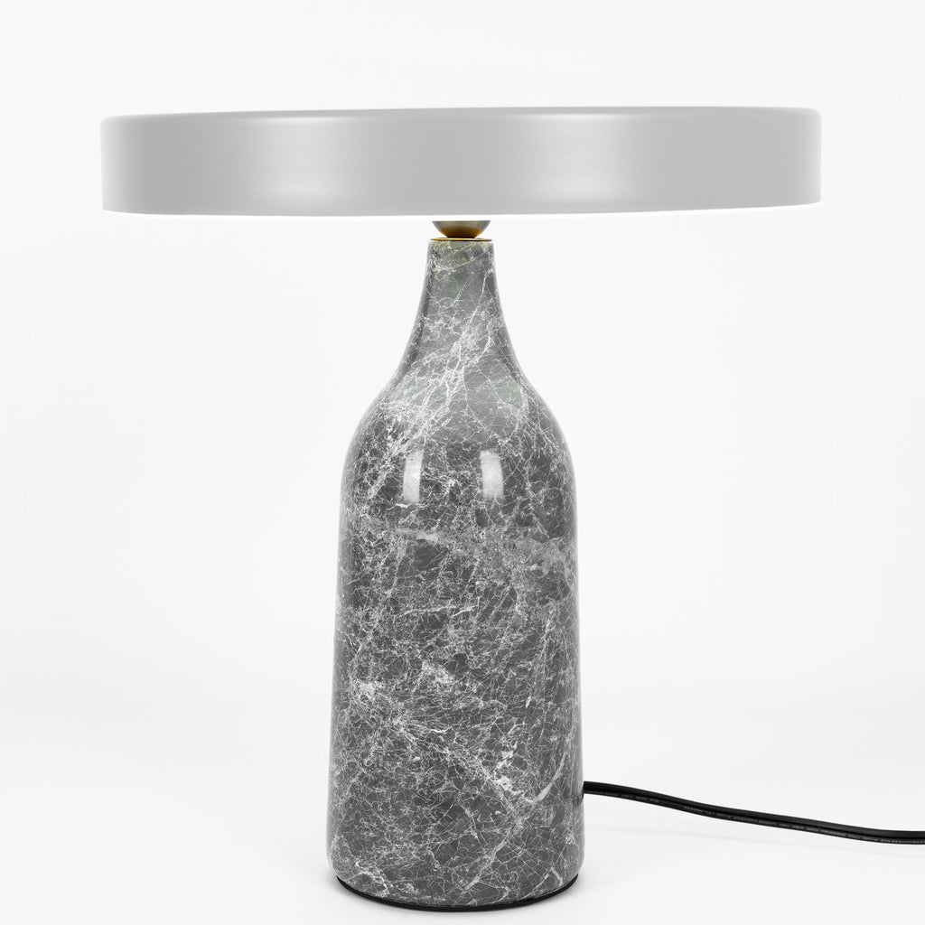 Grey marble Clérachic table lamp with its disc shade held level, shown with its cord on a plain white background.