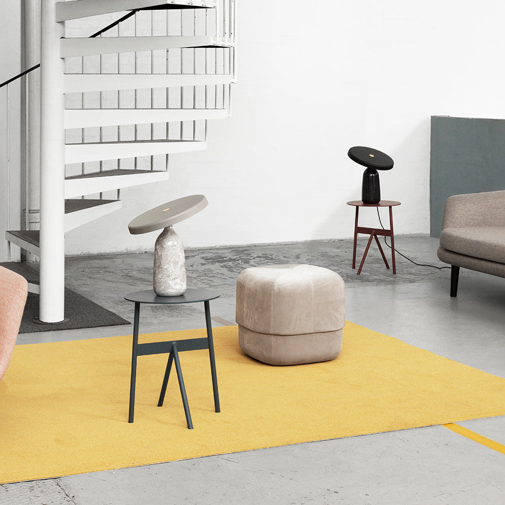 Clérachic table lamps shown among other pieces in a loft living room with a spiral staircase and a mustard rug.