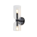 On a plain white background, this matt black Clérachic wall light's clear shades glow faintly.