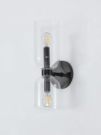 Round backplate and clear glass cylinders define this matt black Clérachic wall light on a white background.