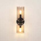 A warm beige wall sets off the lit smoke grey shades of this matt black Clérachic sconce.