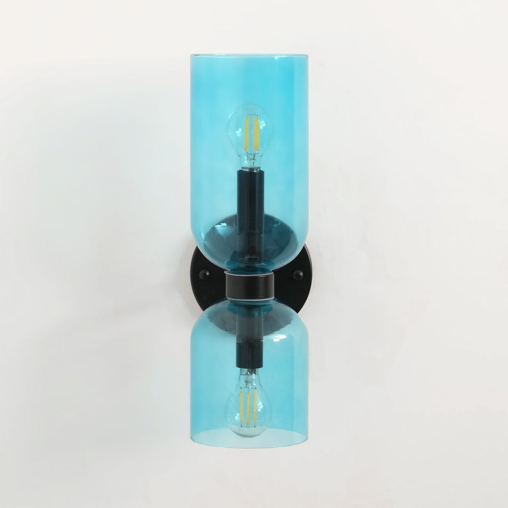 Each blue glass shade on this matt black Clérachic sconce glows around its own bulb.