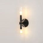 A close view of this matt black Clérachic wall light shows its clear glass shade lit from within.
