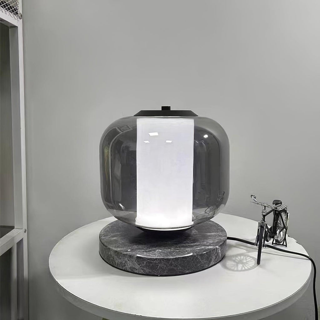 The same Clérachic table lamp on the bedside table now glows cool white rather than warm amber, showing the light tone option.