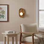 Walnut wood wall lamp close-up of the wood body and white glass shade