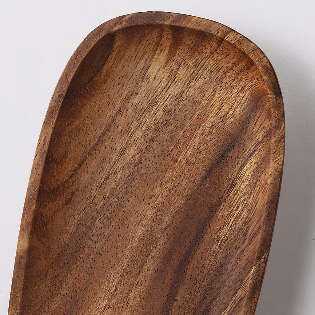 Walnut wood wall lamp mounted on a wall in soft light