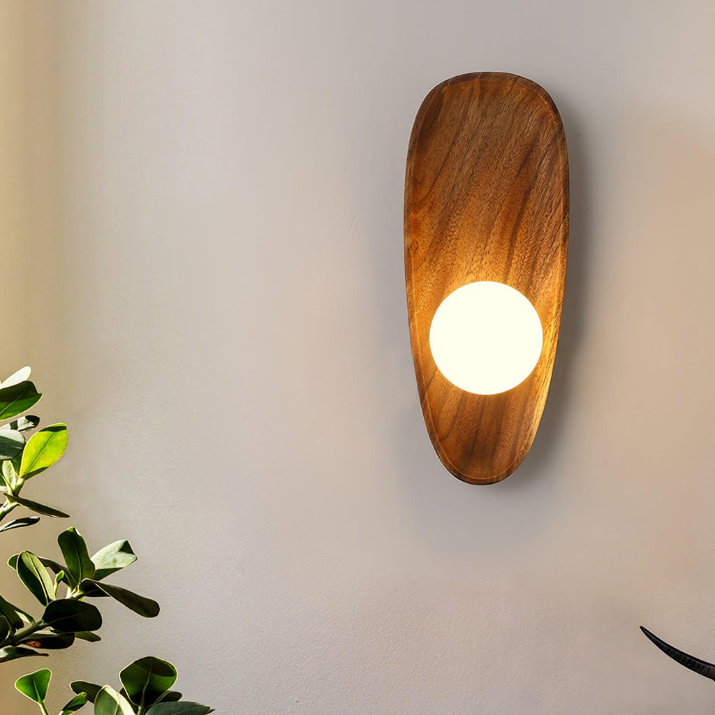 Walnut wood wall lamp detail of the wood and glass join