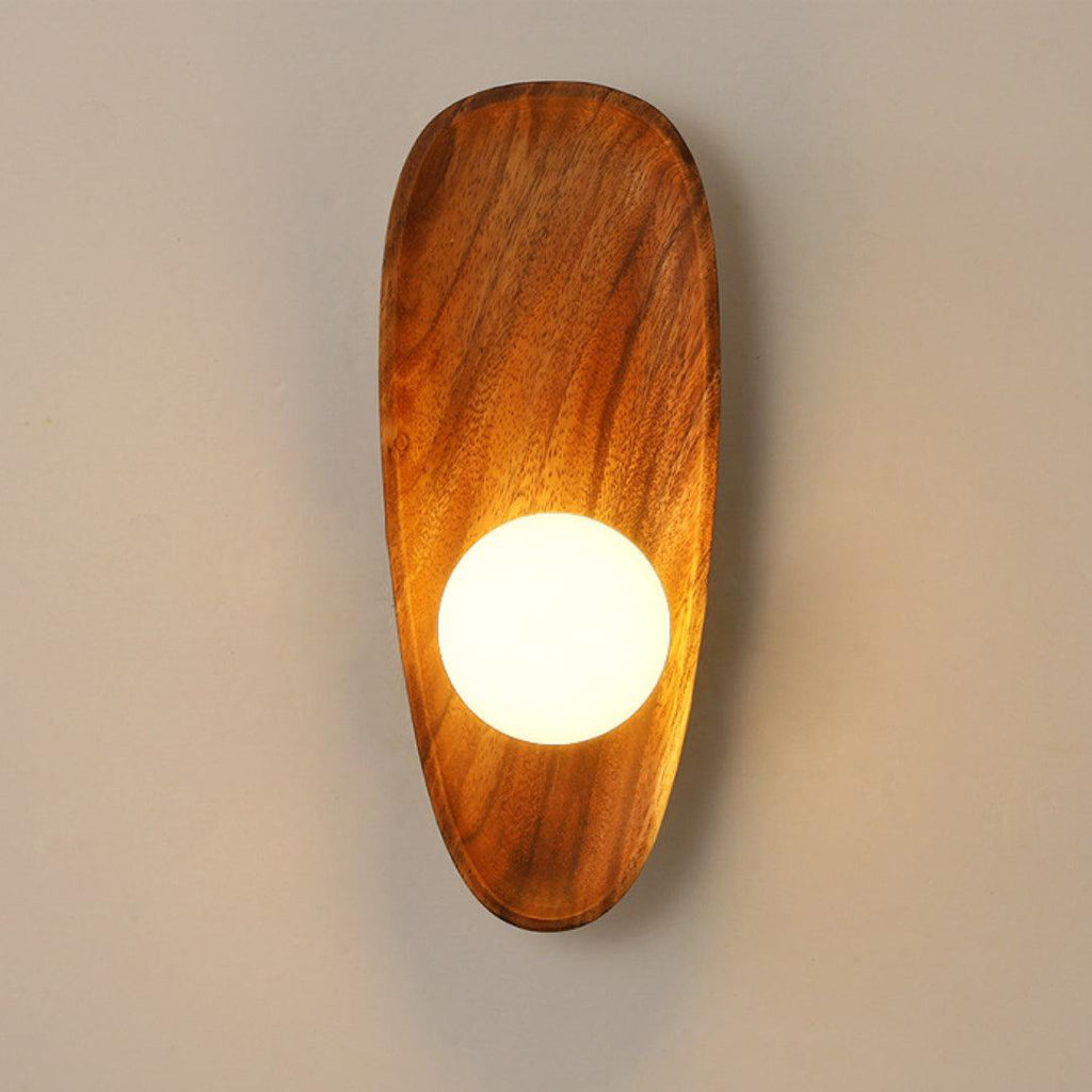 Walnut wood wall lamp close-up of the natural grain