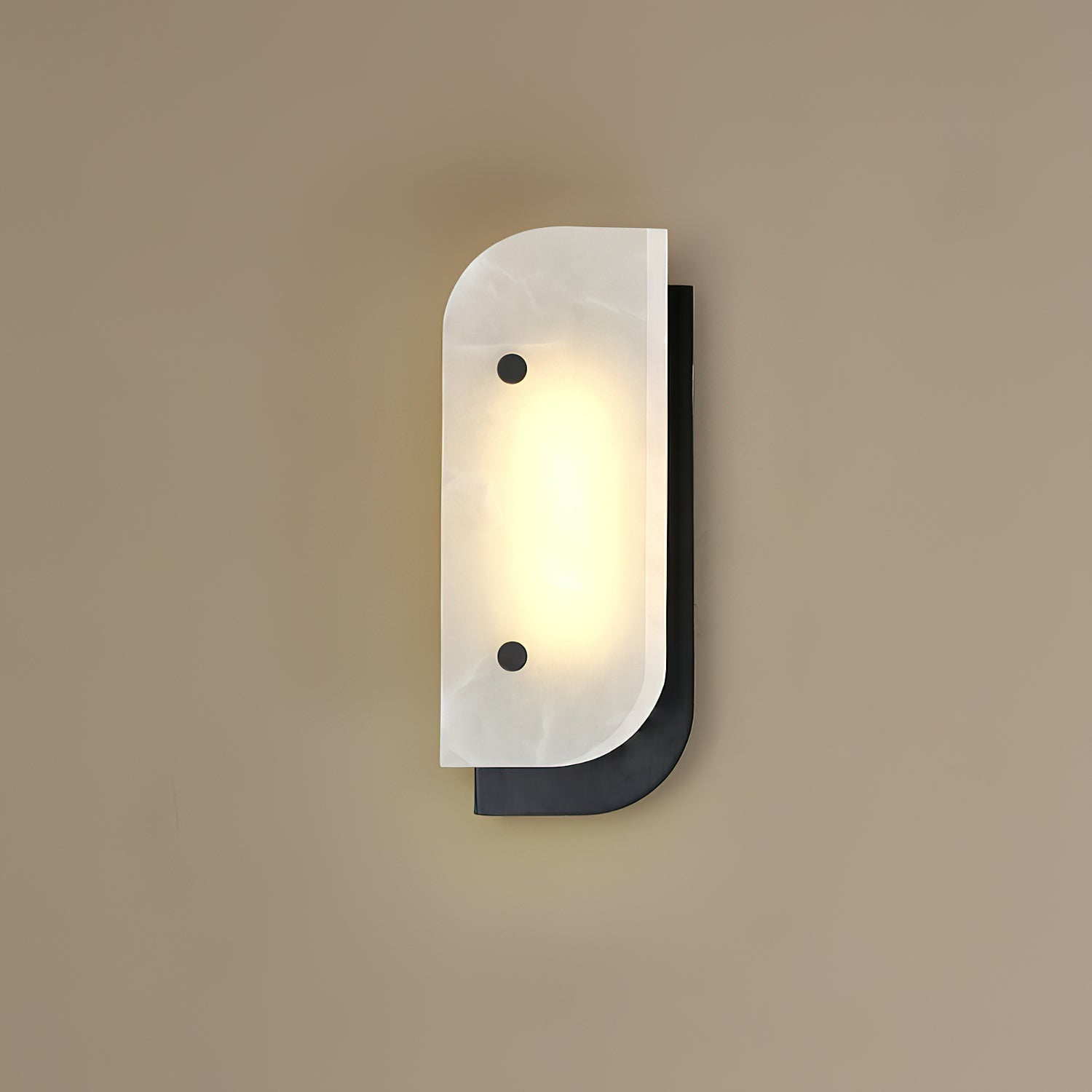 Short Elaris Alabaster Wall Light in black on a taupe wall, stone veining visible in the warm light.