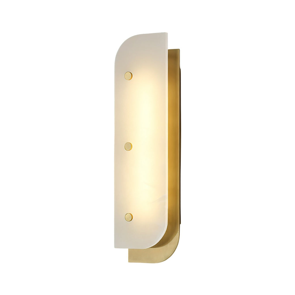 Tall Elaris Alabaster Wall Light on a brass backplate, three brass studs holding the lit stone panel.