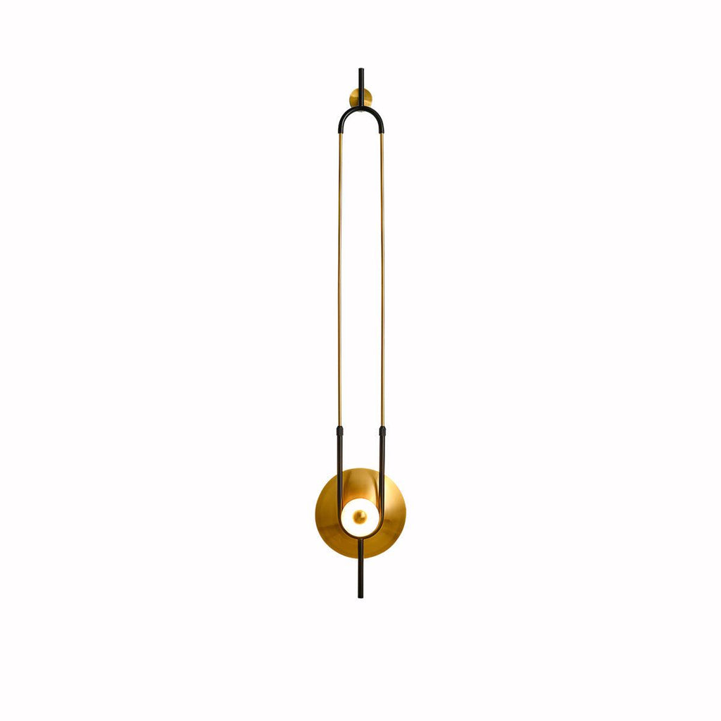 This Clérachic wall sconce is centred on a plain white background, its full gold loop and lit base shown with no shadow.