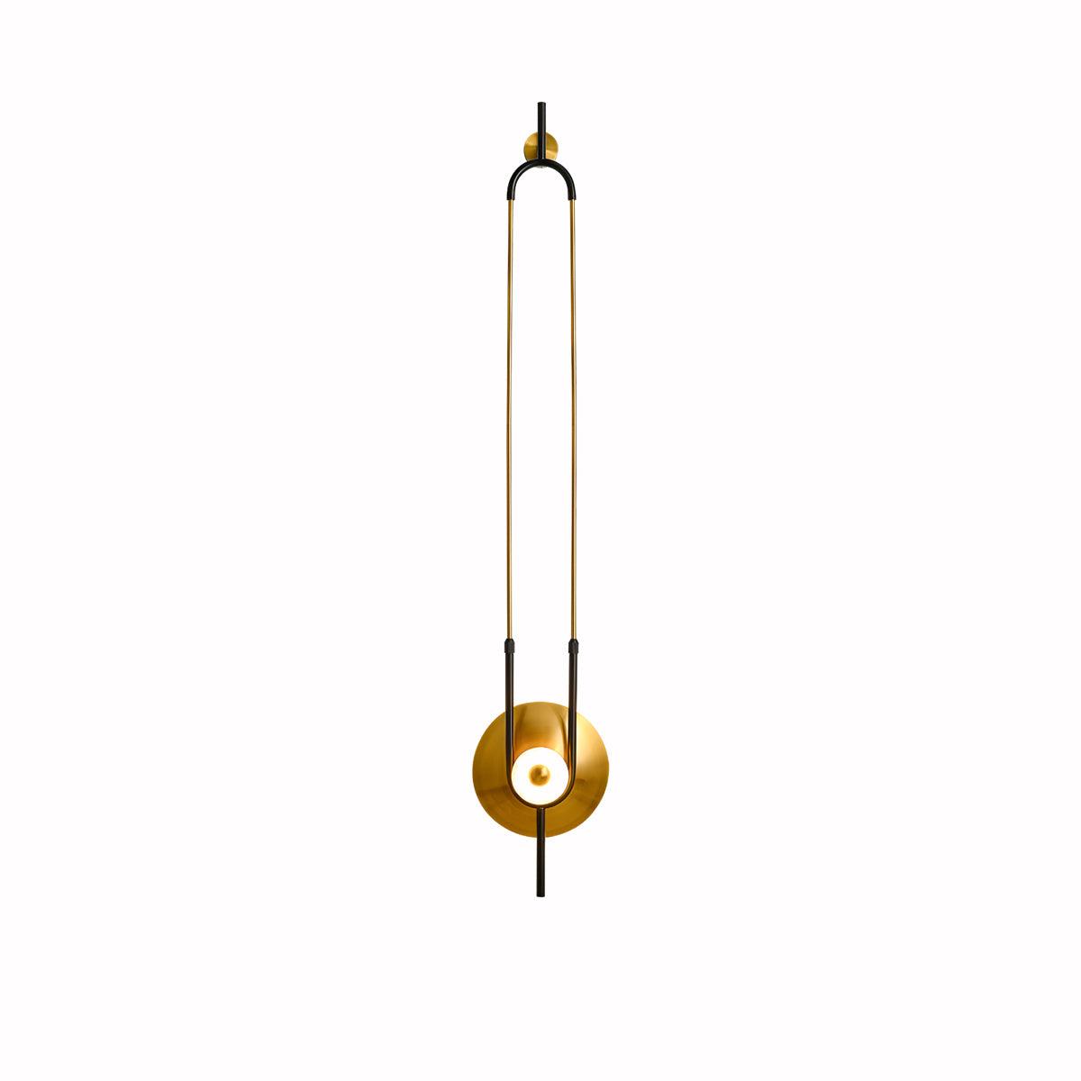 This Clérachic wall sconce is centred on a plain white background, its full gold loop and lit base shown with no shadow.