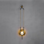 A closer crop of the same Clérachic wall sconce on a grey wall, filling the frame from its gold hook to the round light.