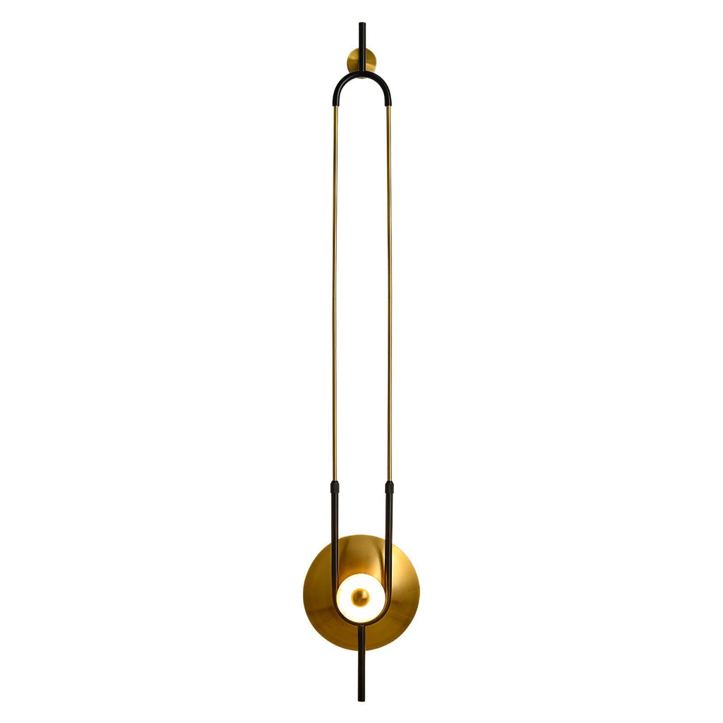 A Clérachic wall sconce sits on a white background with a soft shadow beneath it, its slim gold loop shown off-centre.