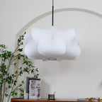 Silk strand pendant light glowing gently at night