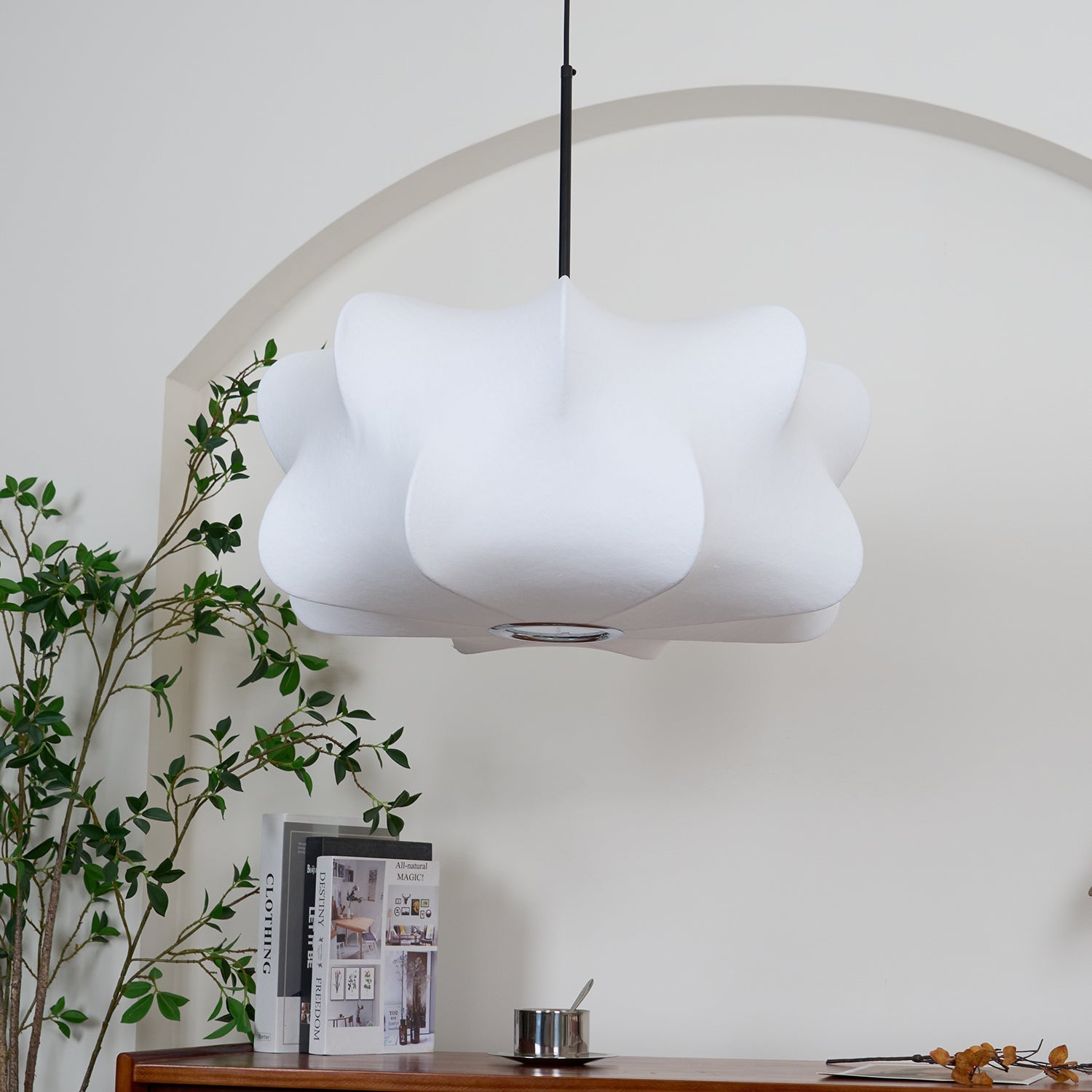 Silk strand pendant light glowing gently at night