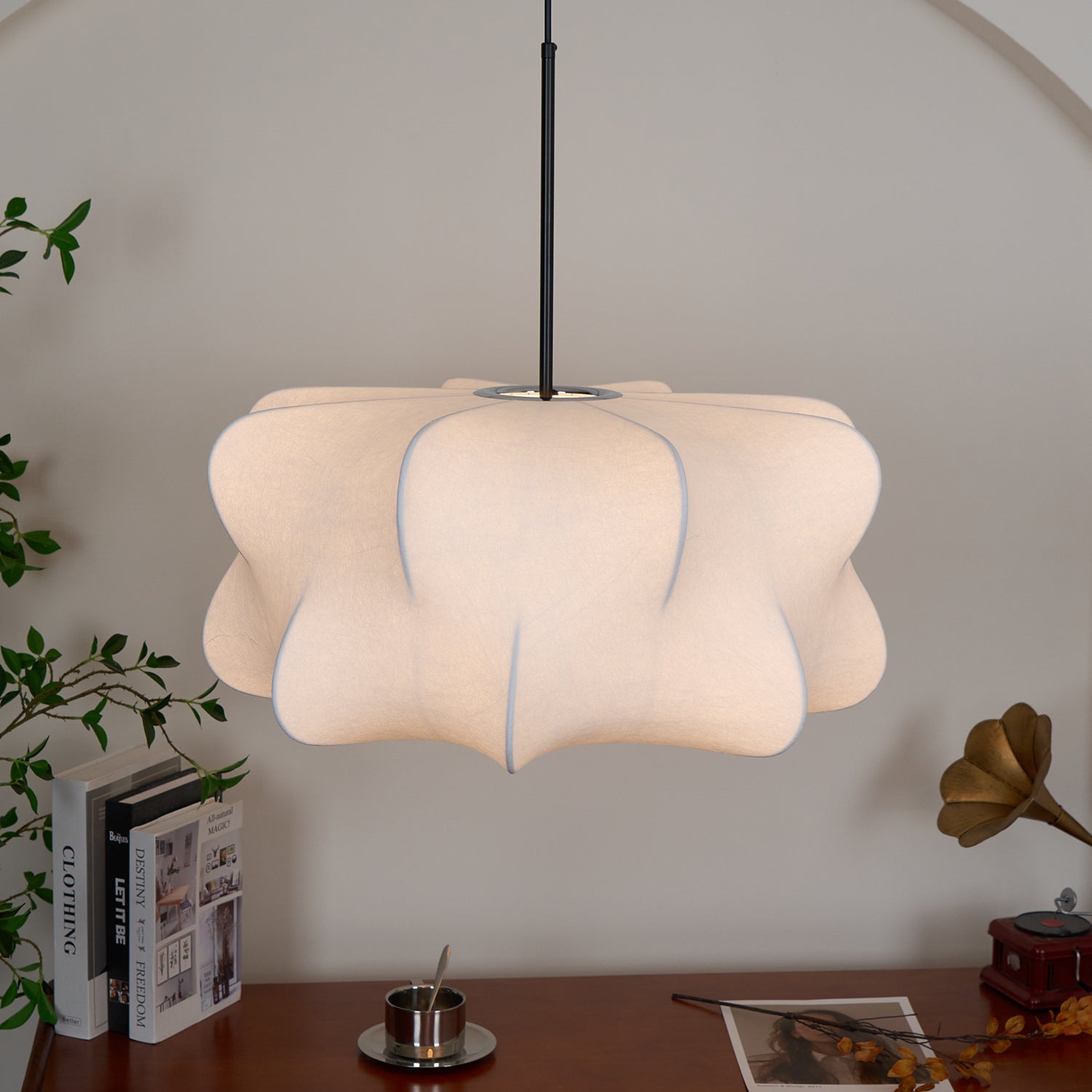 Silk cocoon pendant light shown against a neutral ceiling