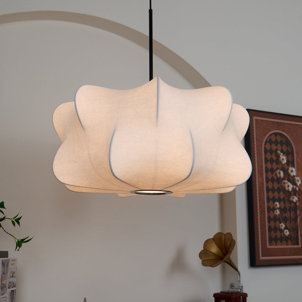 Elysia pendant light suspended above a dining table at dusk