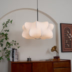 Cloud-shaped silk pendant light lighting a bedroom softly