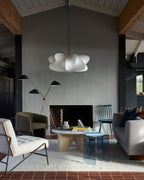 Elysia pendant light glowing softly over a dining setting