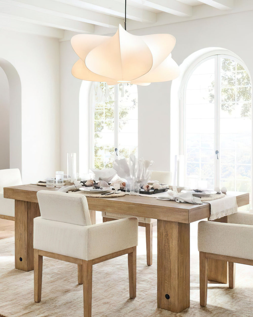 Silk cocoon pendant light shown in a softly furnished room