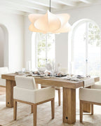 Silk cocoon pendant light shown in a softly furnished room